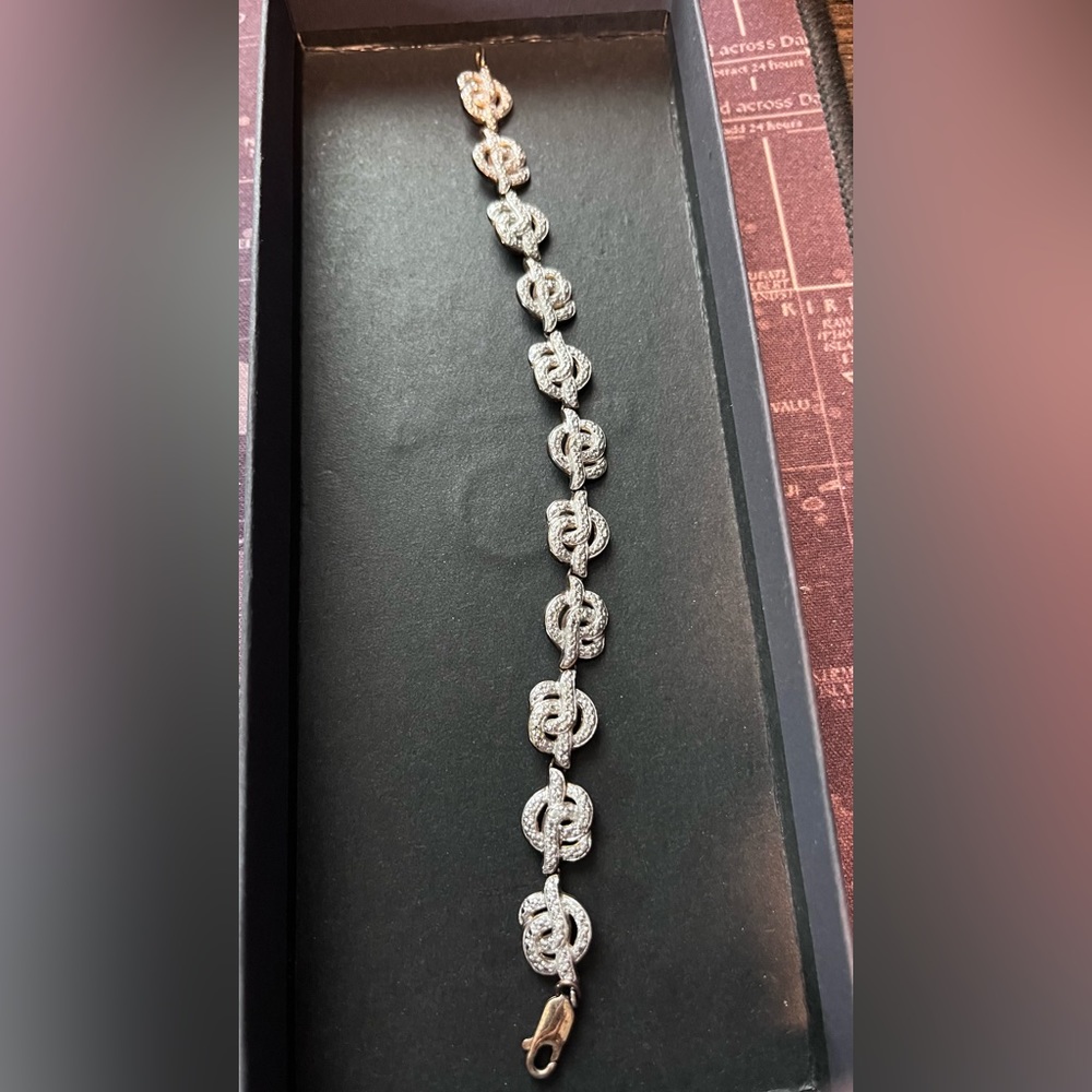 Sterling with gold overlay bracket.